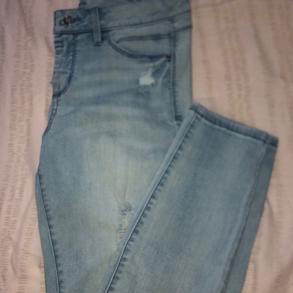 Light blue ripped jeans